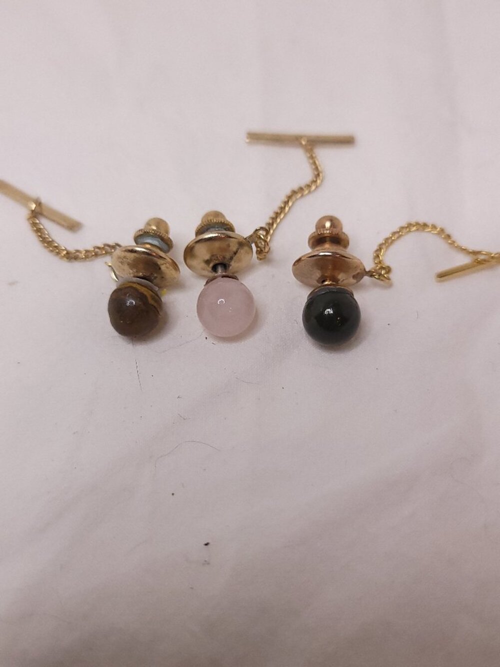 A Trio of Gold Tone Tie Clasps